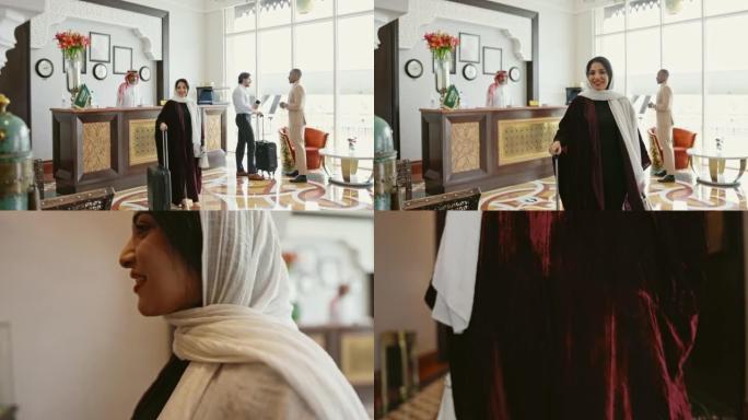 二十多岁的女商人在沙特精品酒店登记入住