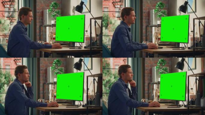 年轻英俊的男人在家工作，在带有绿屏模拟显示的台式计算机上。男性检查公司账户，给同事发信息。带大窗户的