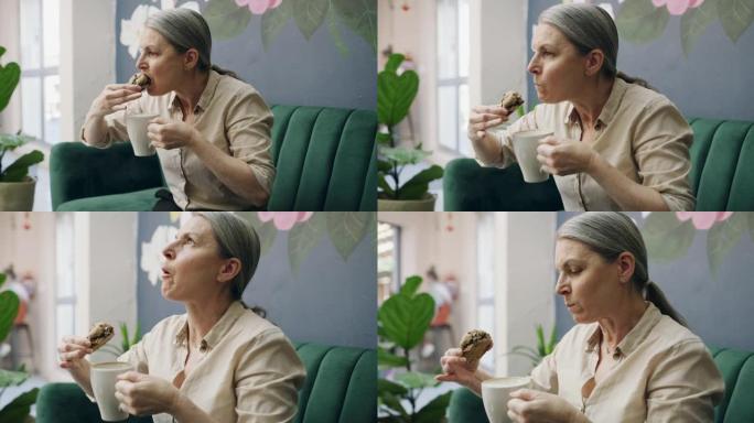一个成熟女人在咖啡馆吃午餐的4k视频片段