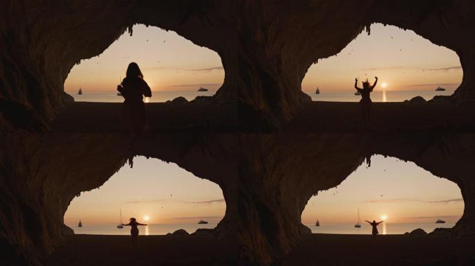 撒丁岛卡拉卢纳海滩上冥想的女人的慢动作视图。意大利。