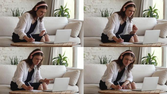 女学生使用笔记本电脑在家学习视频语言