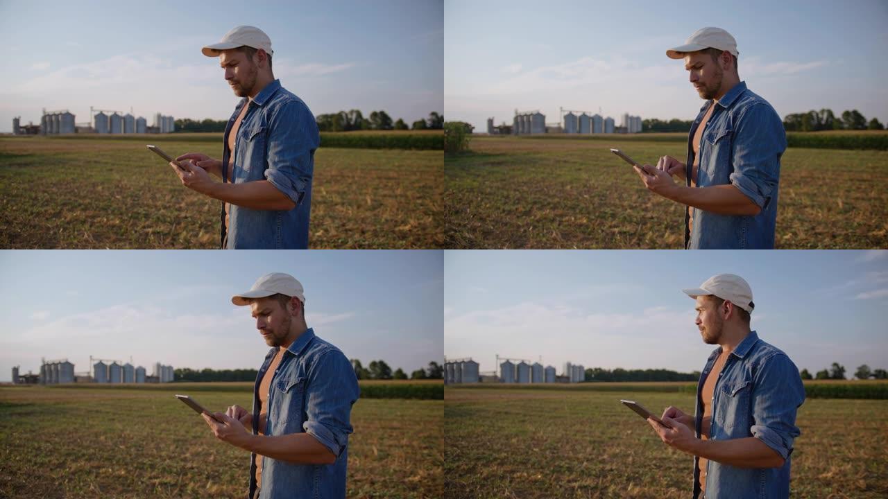 SLO MO Farmer在野外四处张望时使用数字平板电脑