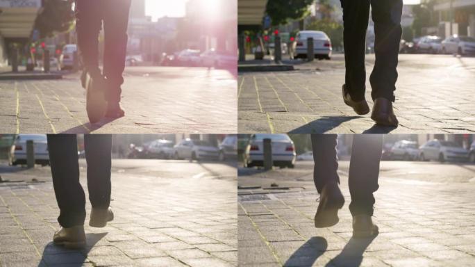 在阳光明媚，阳光明媚或明亮的日子里，在户外和户外步行去城市街道上班的商人的鞋子。腿、正式裤子和公司员