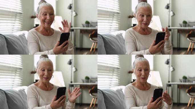 65岁高龄女子手持智能手机通过视频通话