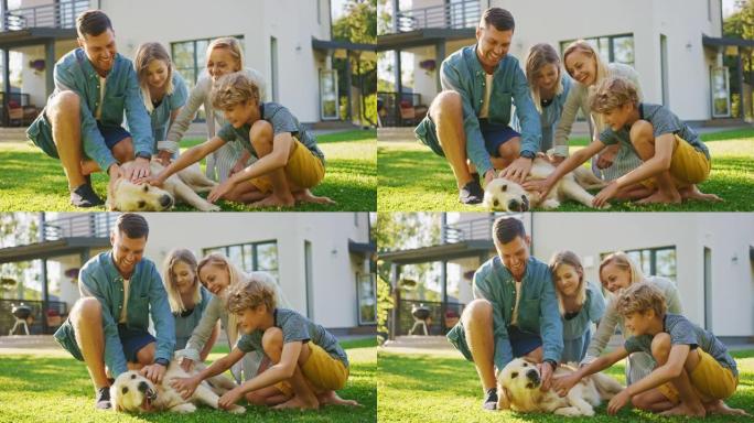 美丽的四口之家与快乐的金毛猎犬在后院草坪上摆姿势。田园诗般的家庭在避暑别墅后院户外拥抱忠诚的血统狗。