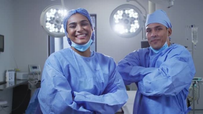 手术室中戴着低口罩的男女外科医生的肖像