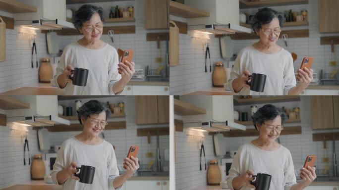 亚洲高级妇女手持咖啡杯与女儿进行视频通话。