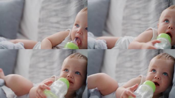 可爱的婴儿在家喝奶瓶健康幼儿4k