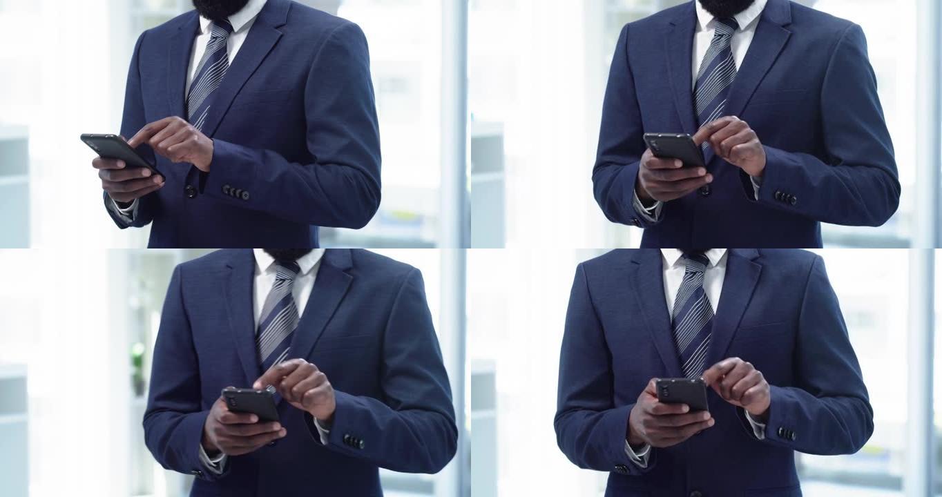 4k视频片段，一个无法识别的商人站在办公室时使用手机