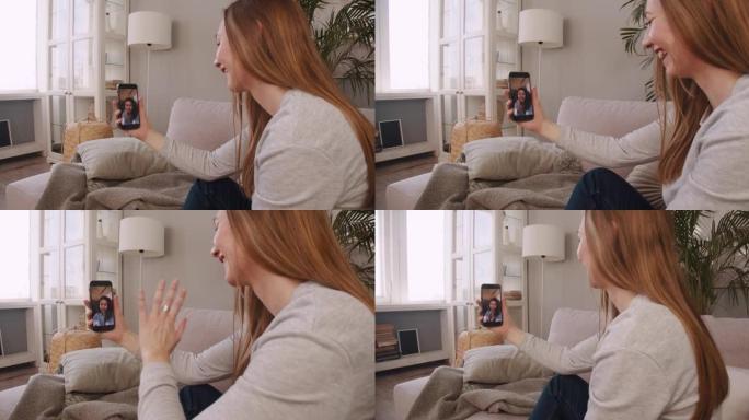 检疫上的友谊。侧视快乐金发女人在家通过智能手机网络会议与混血朋友交谈