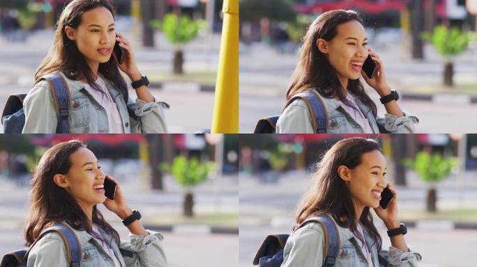亚洲女性在智能手机上聊天并微笑
