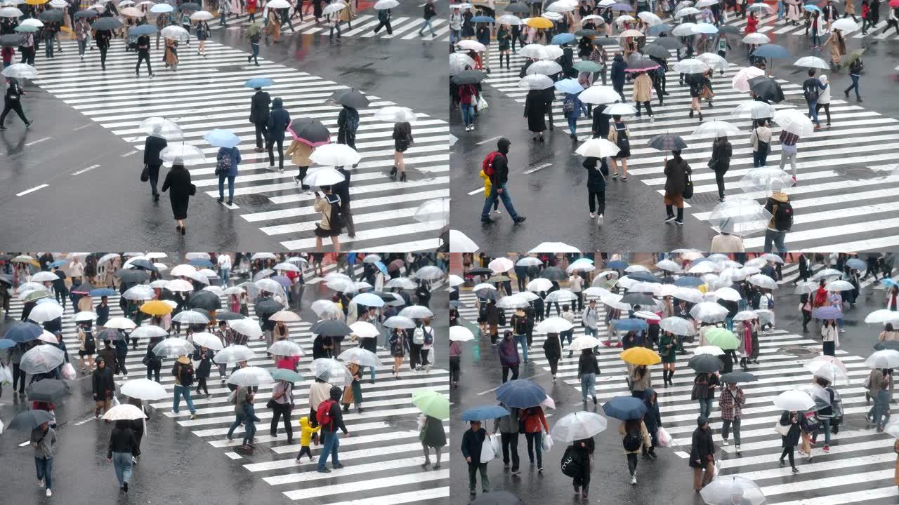 下雨天东京的过街撑伞行人忙碌