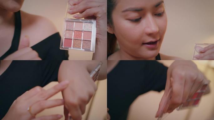 亚洲女性youtube影响者记录教学化妆显示口红颜色在手上。