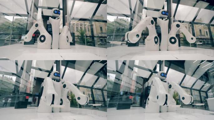 创新，现代技术理念。高科技机器人正在咖啡馆里移动手臂