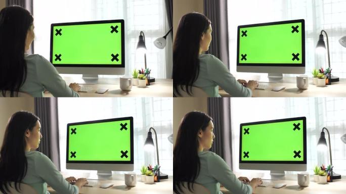 女人在家使用电脑绿屏