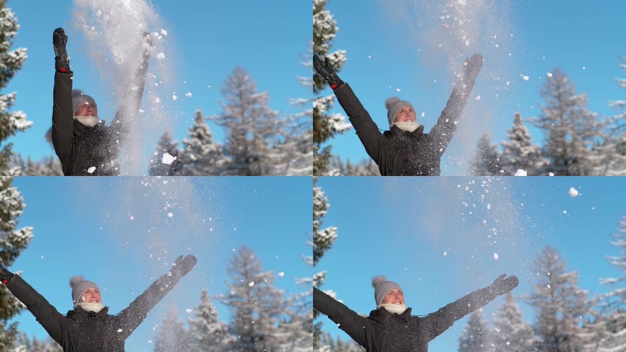 复制空间，dop: 微笑的女人向空中扔雪，伸出手臂。