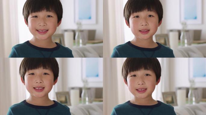 快乐的亚洲小男孩微笑着带着顽皮的表情享受乐趣积极的童年4k镜头的肖像