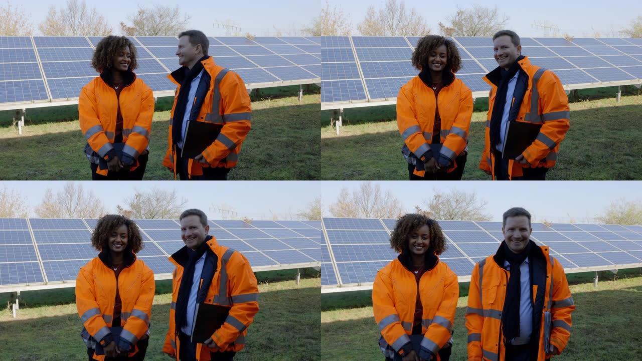 两名在太阳能农场工作的维护工程师的肖像