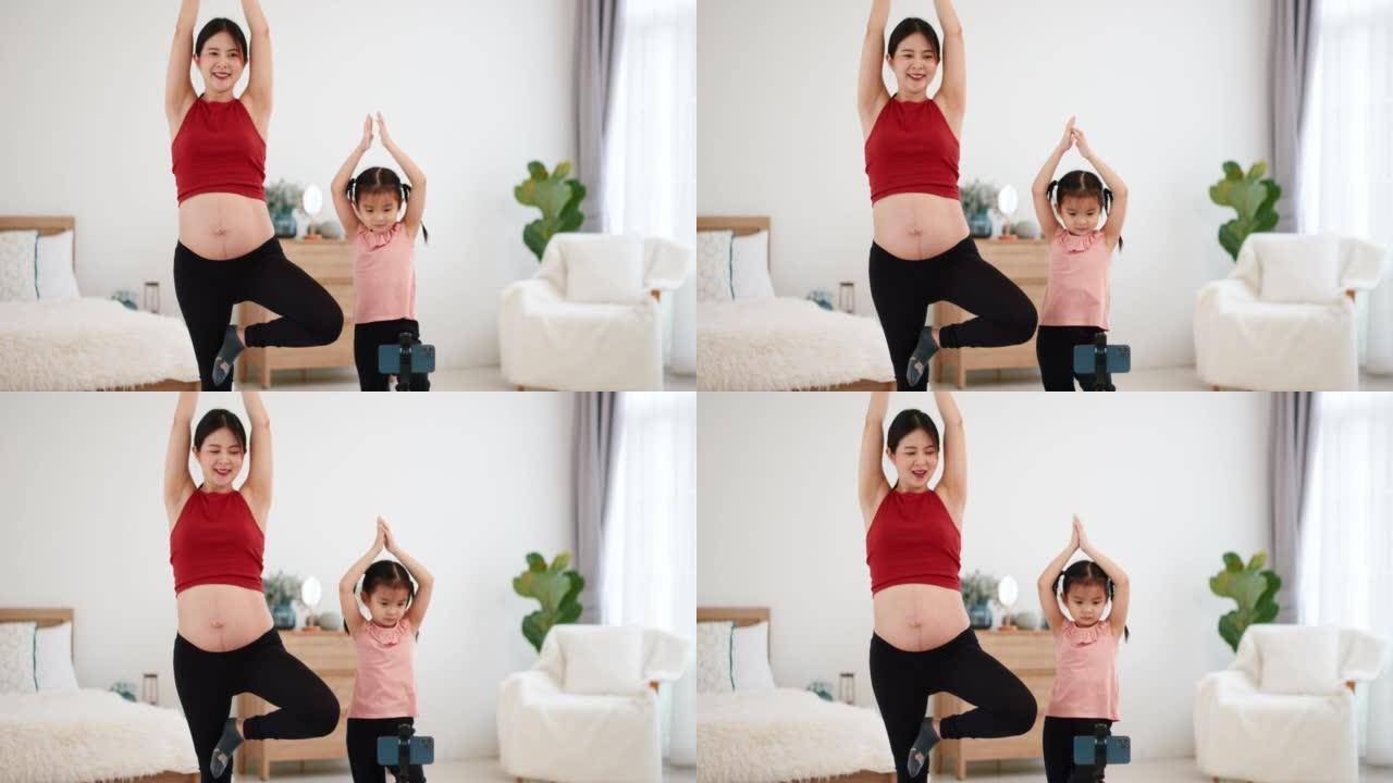 母女俩做瑜伽居家瑜伽健身房伸展孕妇外国运