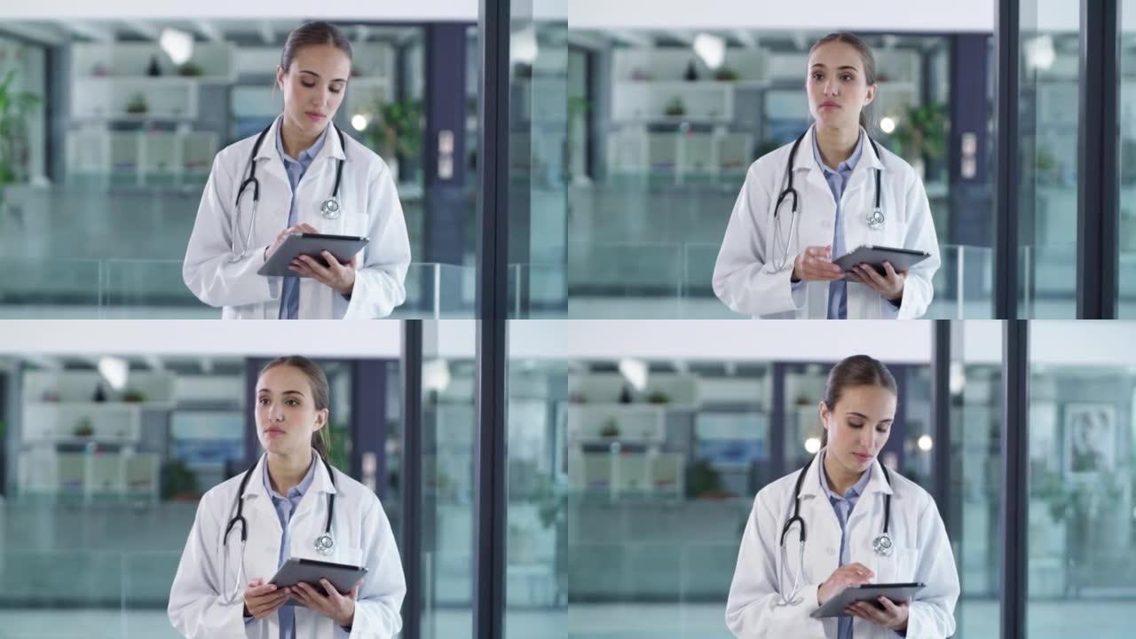 医院里有数字平板电脑的女医生。专注于年轻的医疗专业人员在健康中心步行检查患者。使用现代技术的严肃医护