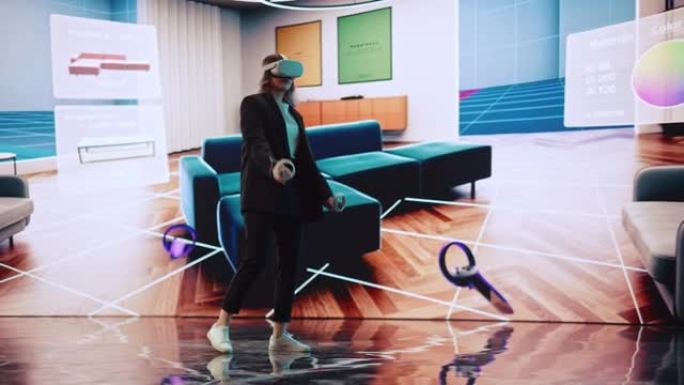 室内设计师使用VR软件设计生活空间。改变沙发的颜色，在大数字屏幕上的互动环境中移动家具。使用耳机和控