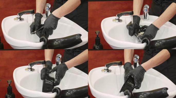 洗发水水槽中戴着手套清洁工具的女性特写视频