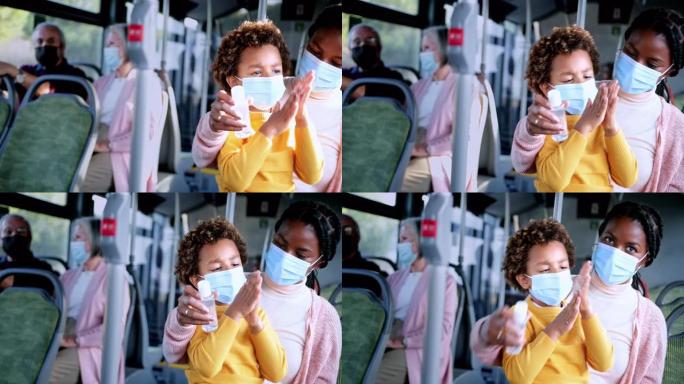 非裔美国母亲戴着covid口罩消毒公交车内的儿子手