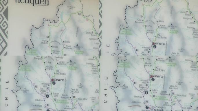 墙上挂着的旅游地图突出了阿根廷旅游信息办公室内的巴塔哥尼亚村庄Varvarco。特写。