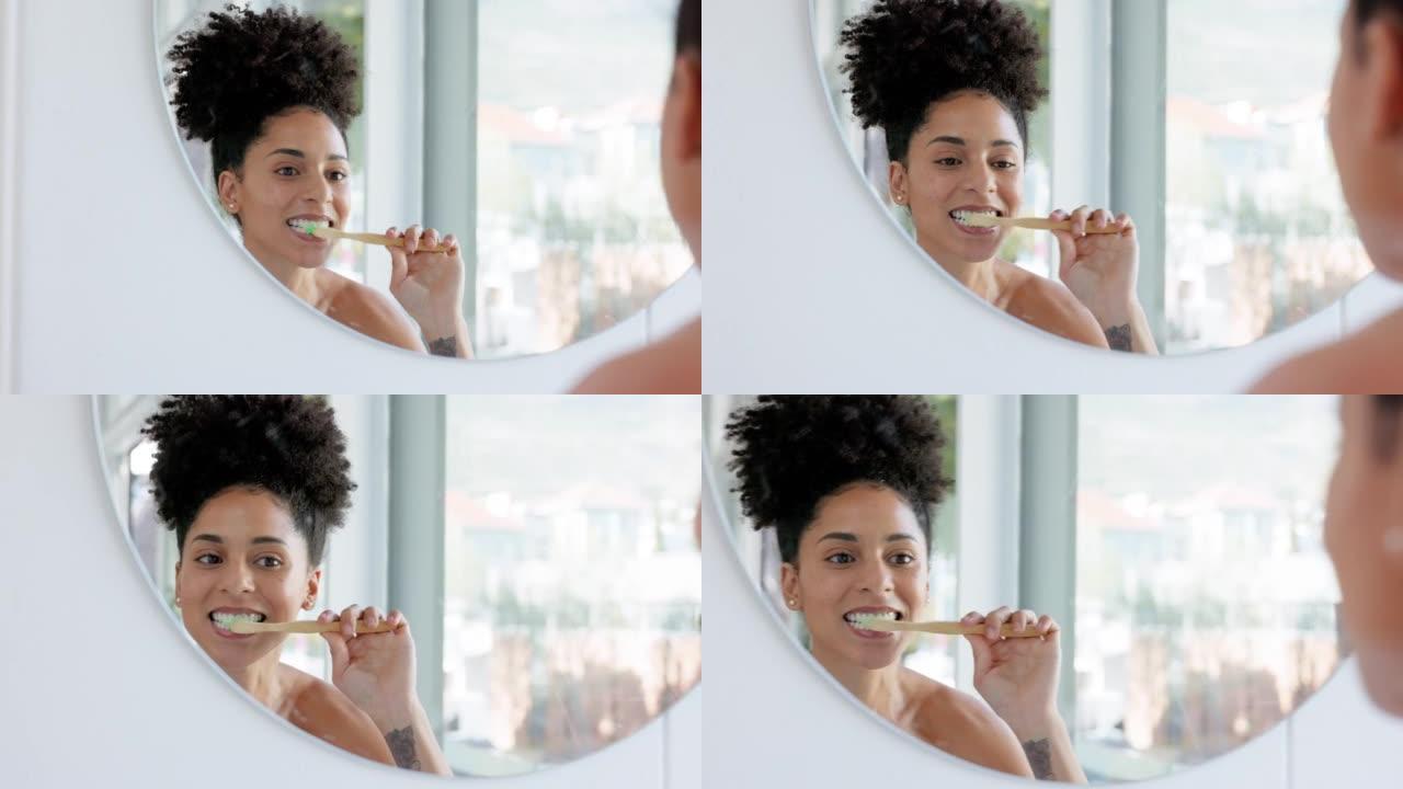早上刷牙、清洁和带浴室镜子的黑人妇女做牙齿卫生。有保健和牙刷的女人用牙膏清洁口腔在家中的日常健康