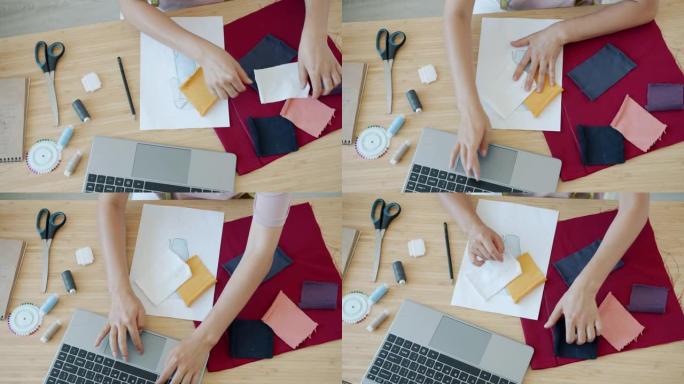 现代时装设计师选择farbic并在桌子上使用笔记本电脑的手的高角度视图