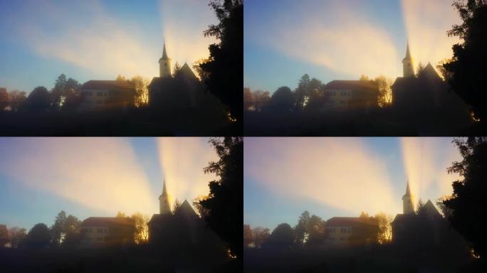 悬挂在山顶上的教堂上的晨雾