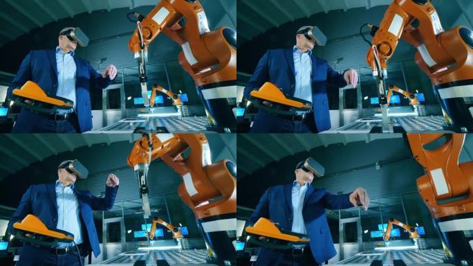 机械臂由一名男性研究人员使用VR设备进行操作