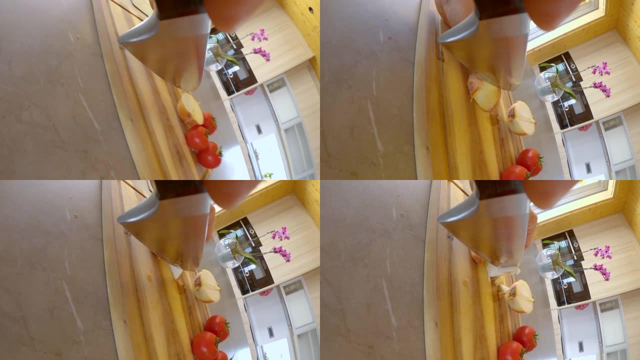 垂直: 无法辨认的厨师刀整齐地切成有机洋葱。