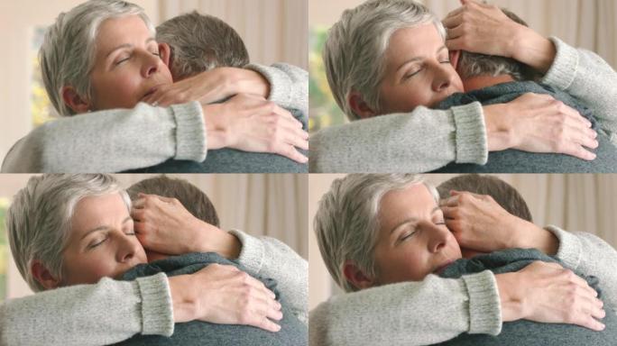悲伤的高级夫妇在听到坏消息后拥抱，给予支持和爱，使他们沮丧。老年白人妇女在癌症诊断后提供安慰，护理和