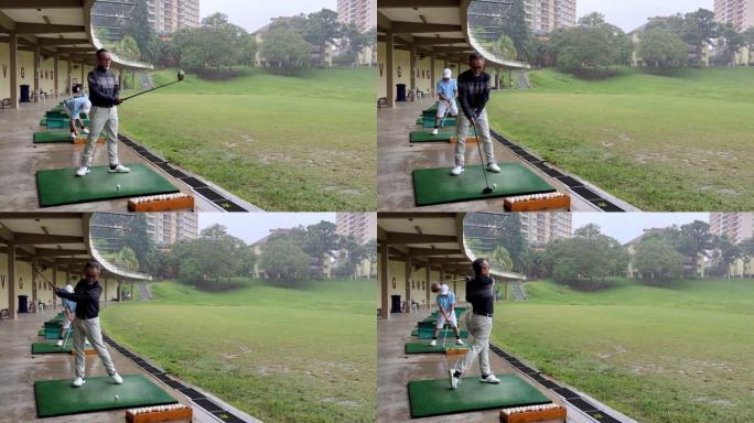 亚洲中国活跃的高级高尔夫球手开球，在高尔夫练习场挥杆他的潜水员高尔夫俱乐部