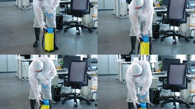 公用事业工人使用手动消毒剂喷雾机消毒办公室