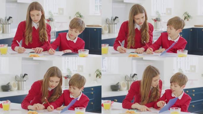 十几岁的女孩穿着校服帮助哥哥在厨房柜台上做作业
