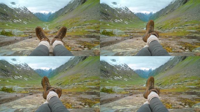 4k视频片段，一个无法识别的女人独自坐在Stryn欣赏山景
