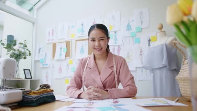 微笑亚洲女性时装设计师小企业主企业家。