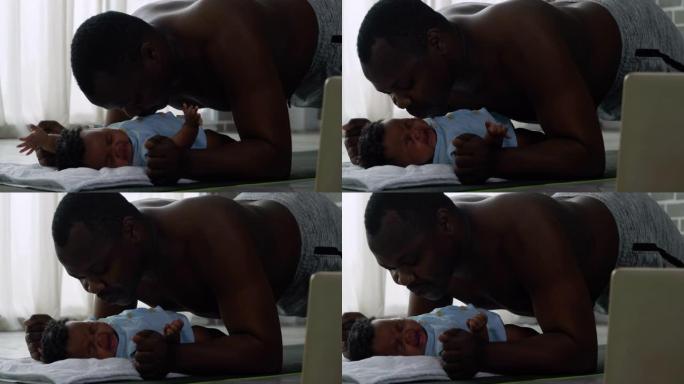 非洲父亲家庭伸展肌肉，在社交距离期间与新生儿接吻3个月时呆在家里，一起呆在家里预防流行病。在没有传统