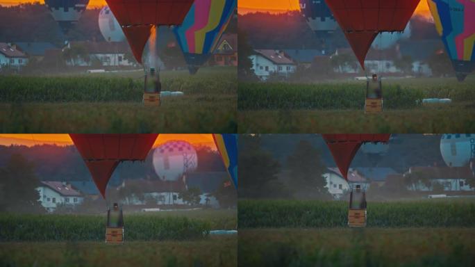日出时在农村地区起飞的热气球男子