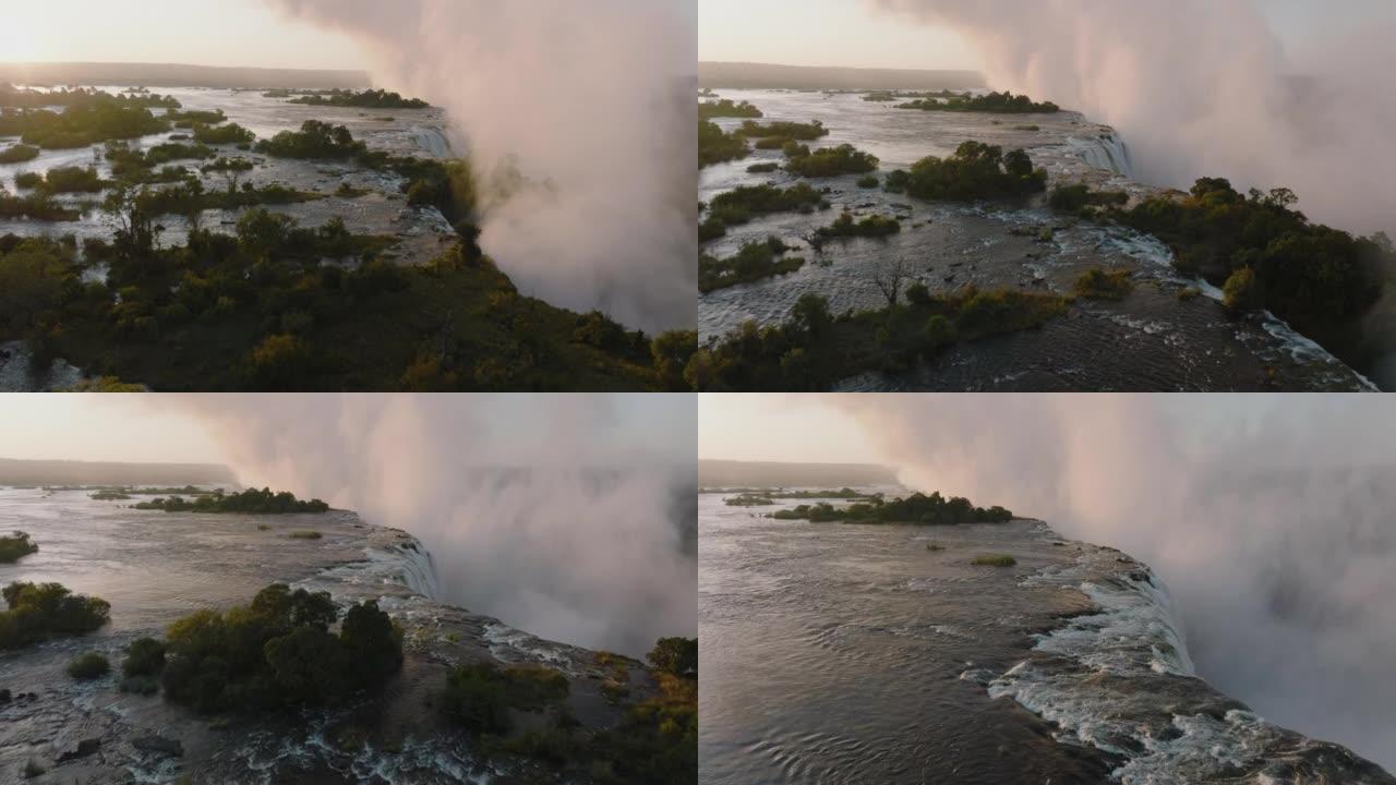 空中特写日出，看到了联合国教科文组织世界遗产维多利亚瀑布边缘的薄雾和水