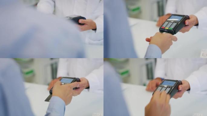 药剂师的特写镜头正在将POS终端移交给患者，以便在药品商店进行非接触式付款。