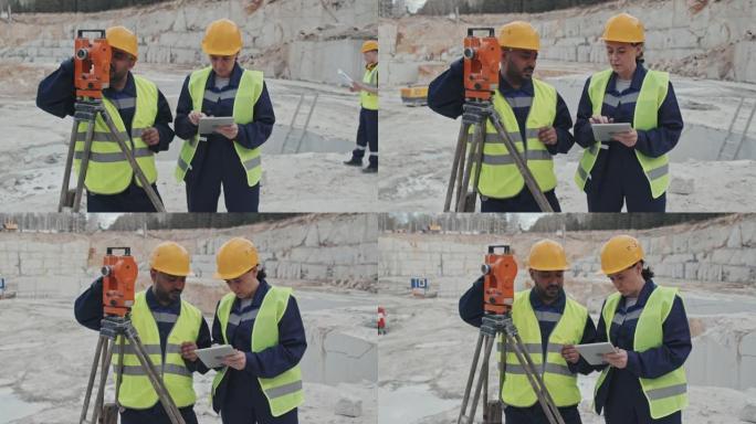 采石场使用测量设备的工人