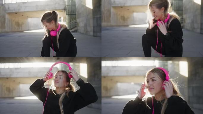 锻炼前戴上耳机女孩早晨运动
