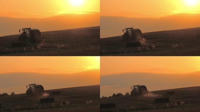 SLO MO Farmer在日落时分在田野上驾驶拖拉机
