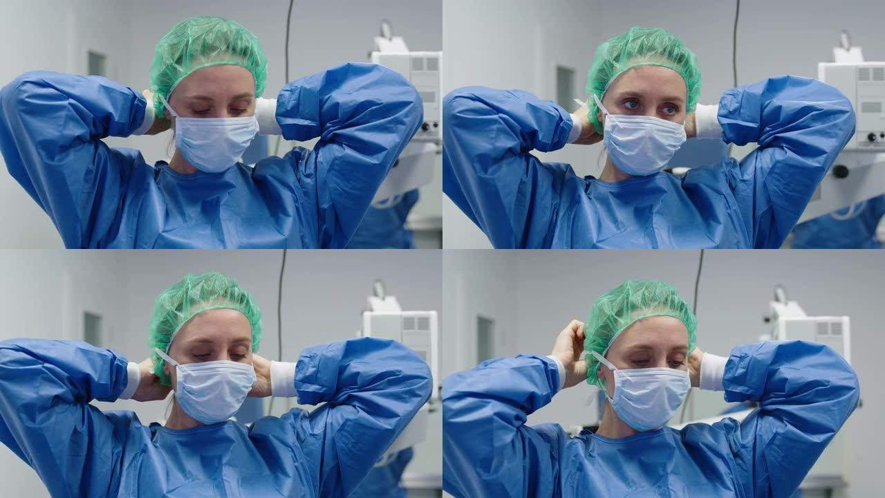 眼科医生穿着无菌手术服，戴上外科口罩进行手术