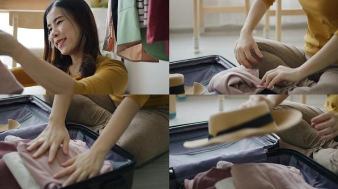年轻的亚洲妇女设置行李箱/行李