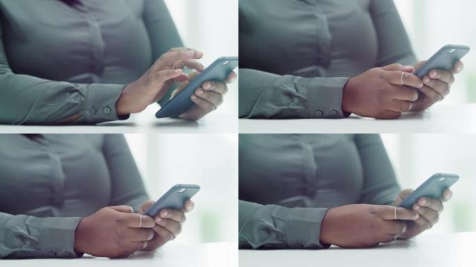 4k视频片段，一个无法识别的女人在现代办公室中使用手机