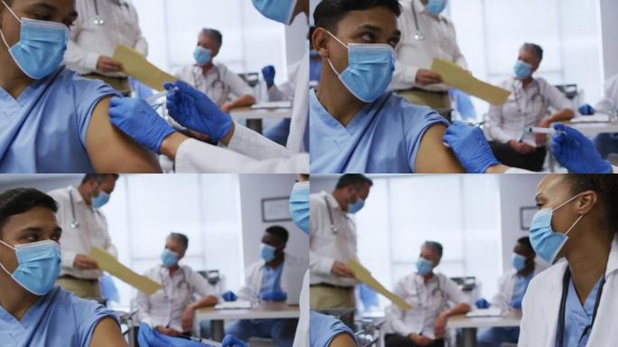 混血女医生在医院给男同事接种covid疫苗，都戴着口罩